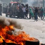 Clashes erupted in West Bank's Qusra as Israeli forces moved to evacuate a settler outpost built near Palestinian homes and used riot-control measures.