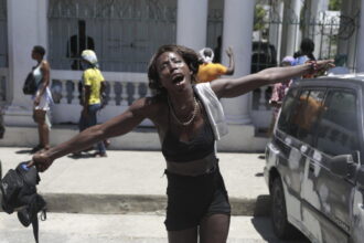 Around 40 people have been killed in a gang attack on a church shelter for displaced people near Port-au-Prince, Haiti.