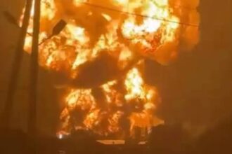Firefighters respond after a Russian missile strike damaged buildings in Kyiv, Ukraine.