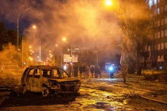 Firefighters respond after a Russian ballistic missile strike damaged warehouses and buildings in Kyiv, Ukraine.