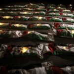 Gaza holds a mass funeral for around 100 Palestinians, including 70 children, as rescuers continue searching for bodies under destroyed buildings.
