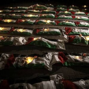 Gaza holds a mass funeral for around 100 Palestinians, including 70 children, as rescuers continue searching for bodies under destroyed buildings.